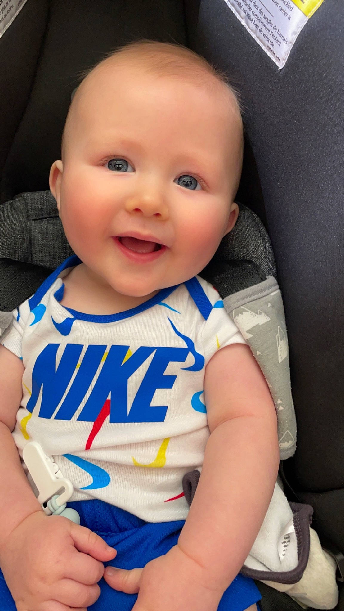 Easton is registered to the contest to win money with this photo: baby, baby_toddler_clothing, cheek, chin, eye, eyebrow, face, gesture, happy, head, human_body, iris, joy, lip, mouth, neck, nose, person, skin, sleeve