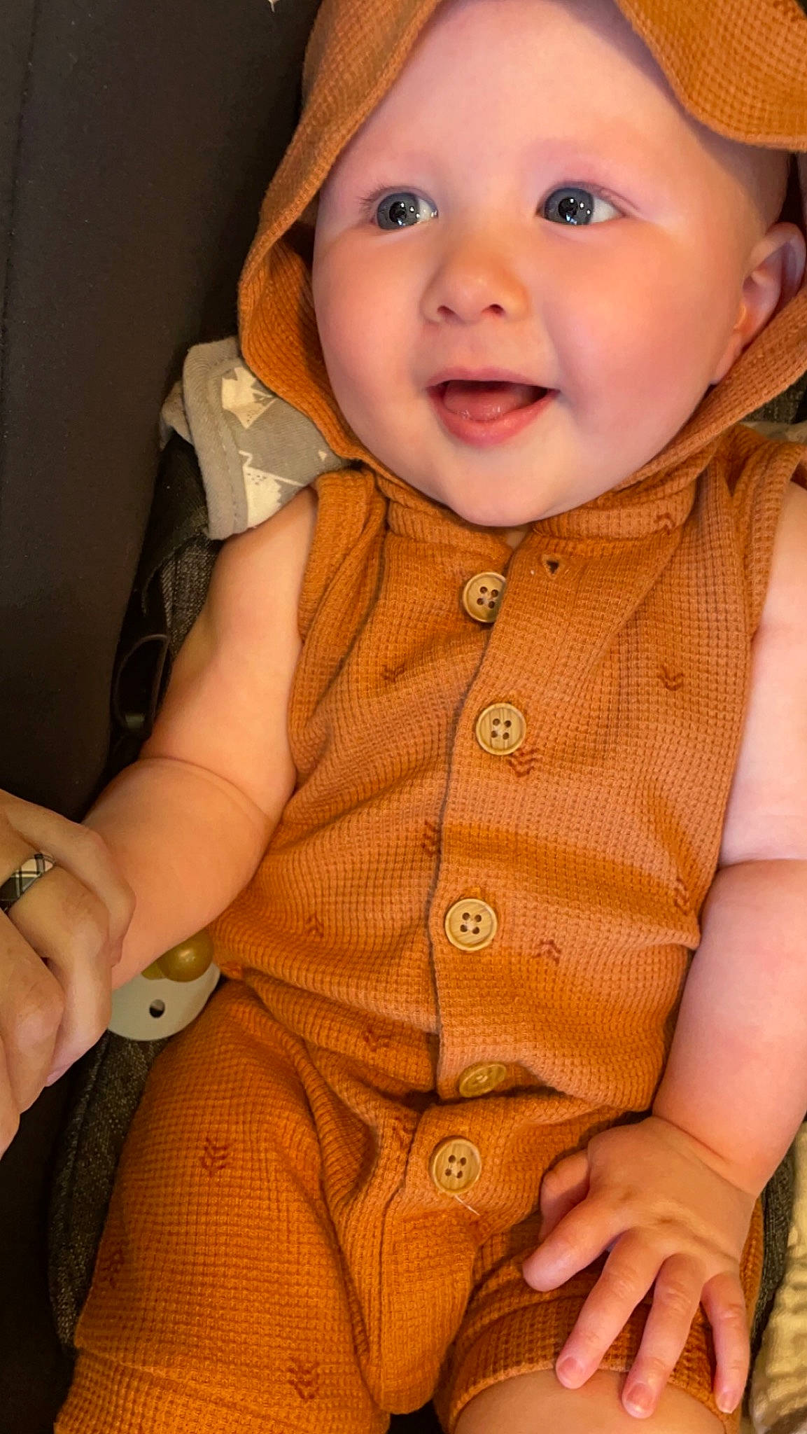 Easton is registered to the contest to win money with this photo: baby, baby_toddler_clothing, cheek, chin, collar, dress_shirt, eye, facial_expression, finger, hand, happy, headwear, human_body, iris, joy, lip, nose, outerwear, person, skin