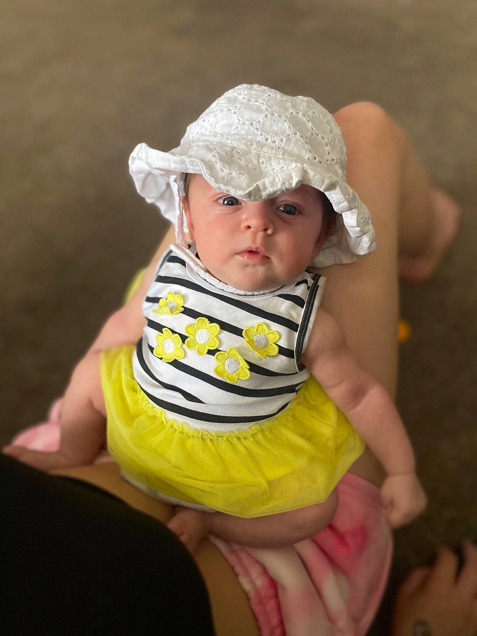 Kylene is registered to the contest to win money with this photo: baby, baby_products, baby_toddler_clothing, cap, cheek, child, dress, eye, face, finger, flash_photography, fun, grass, hand, happy, head, headwear, human_body, people_in_nature, person