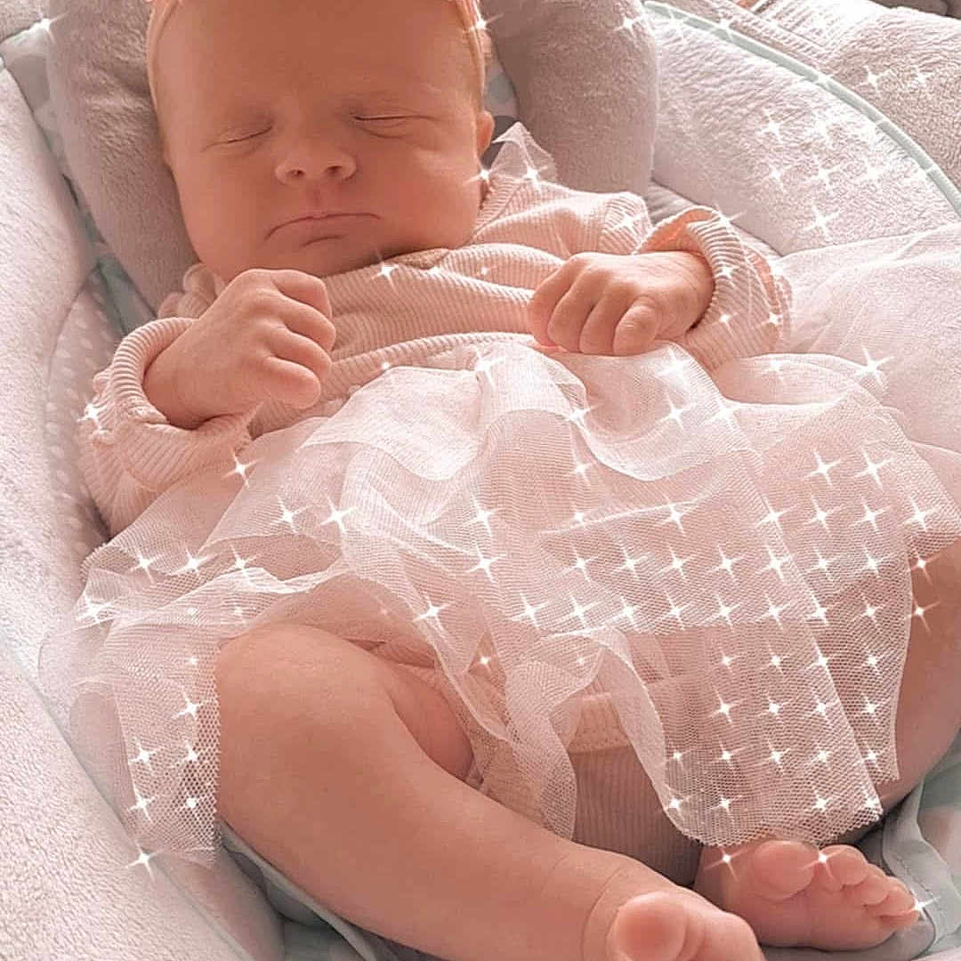 Annie Guinet participe au concours pour gagner de l'argent avec cette photo : baby, blanket, closeup, cushion, cute, dress, face, feet, flower, hands, headband, indoors, infant, newborn, peaceful, pink, sleeping, soft, sparkles, tulle