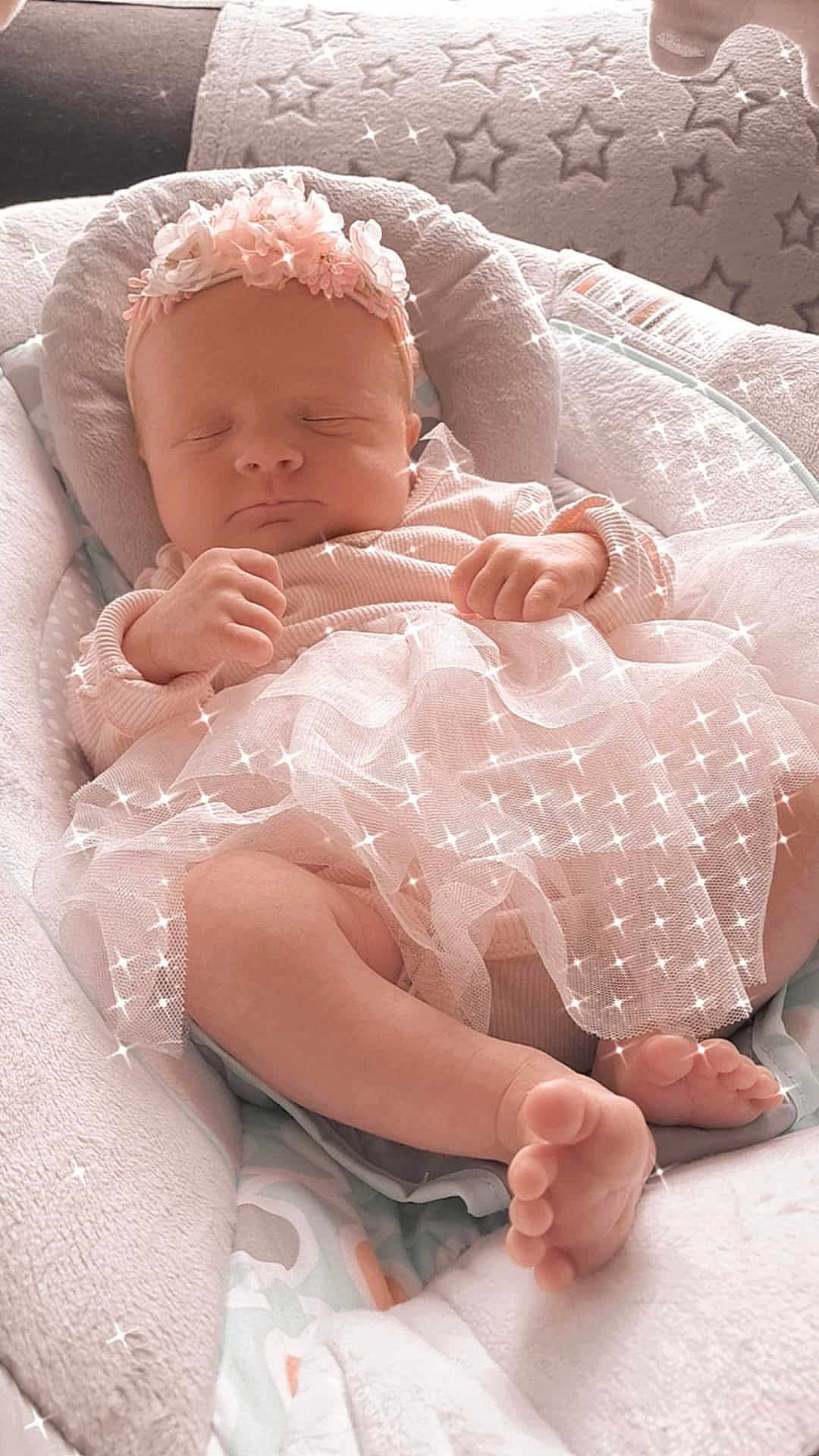 Annie Guinet participe au concours pour gagner de l'argent avec cette photo : baby, sleeping, infant, pink, headband, flower, cushion, blanket, soft, tulle, dress, peaceful, closeup, indoors, newborn, feet, hands, face, cute, sparkles