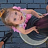 Selene joined the competition — help win amazing prizes! toddler, child, pink_dress, lamp_post, cobblestone, street, smile, happy, looking_up, outdoor, footwear, black_sneakers, legs, hands, daylight, playful, curly_hair, person, urban, casual
