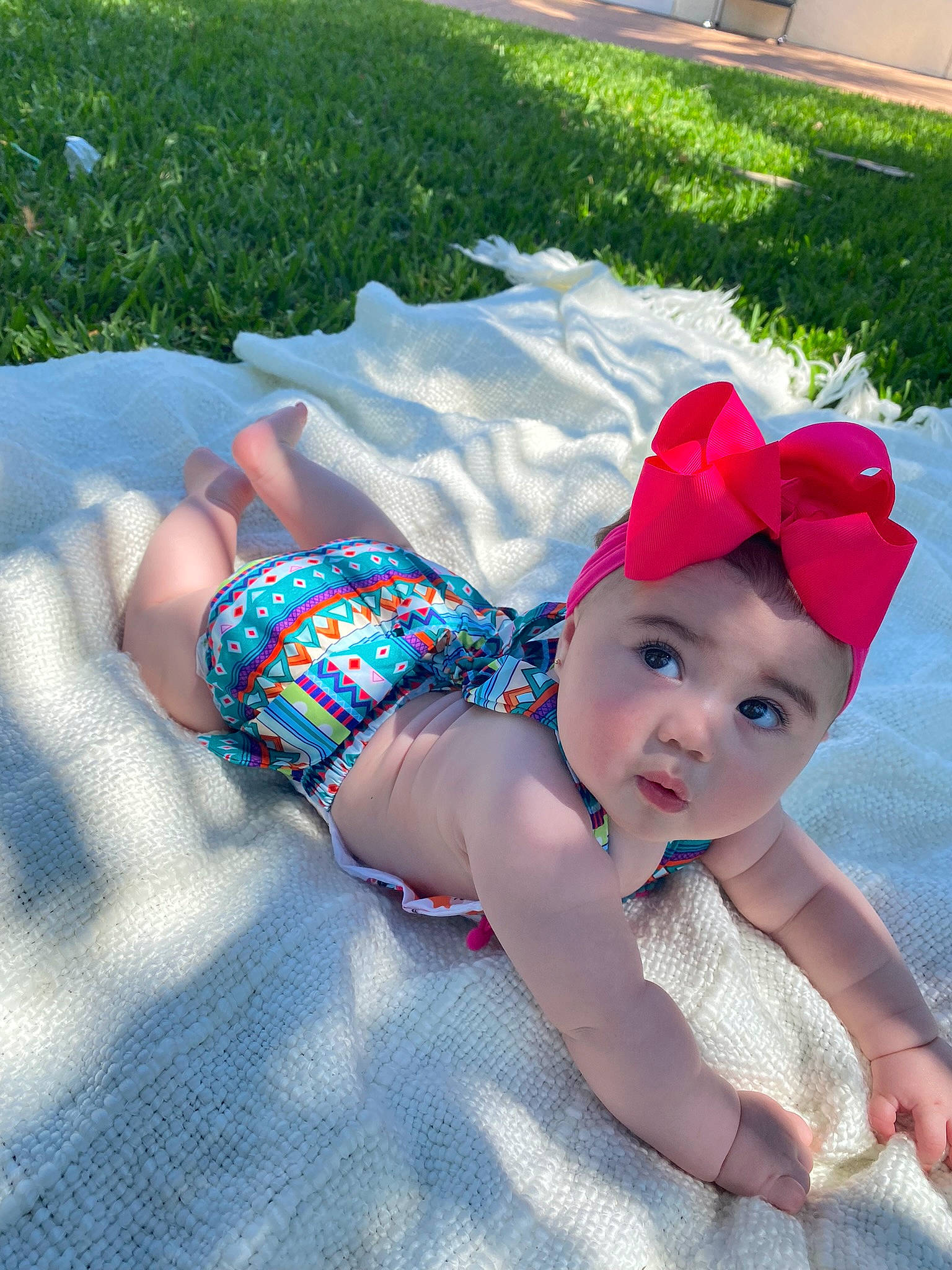 Liv joined the competition — help win amazing prizes! baby, baby_products, baby_toddler_clothing, cap, fashion_accessory, foot, fun, grass, happy, hat, headgear, headwear, human_body, leisure, magenta, pattern, person, plant, sitting, sun_hat