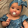 adorable, baby, blue_clothing, child, closeup, cute, eyes, face, hand, headband, heart_pattern, indoors, infant, pacifier, peaceful, portrait, sitting, skin, soft_blanket, young
