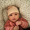 Rym participe au concours pour gagner de l'argent avec cette photo : baby, beige, blanket, cozy, cushion, cute, face, hat, heart_pattern, indoor, infant, newborn, pink, portrait, resting, small_hands, soft, sweater, warm, wide_eyes