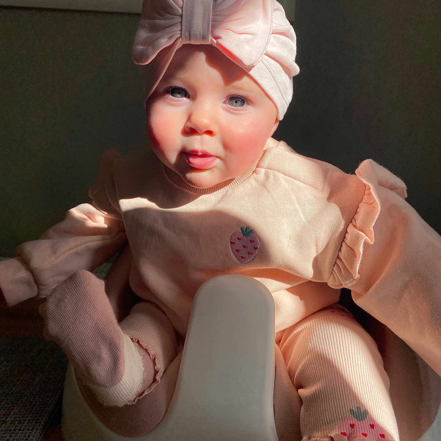 Harper joined the competition — help win amazing prizes! baby, bathroom, bonnet, clothing, costume, dress, face, furniture, hat, head, hosiery, indoors, person, photography, portrait, potty, room, sitting, sock, toilet