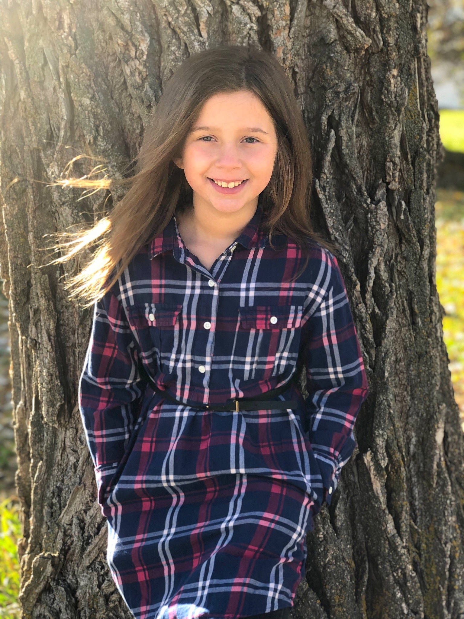 Madison is registered to the contest to win money with this photo: beauty, child_model, clothing, design, eye, joy, lady, lip, long_hair, outerwear, pattern, person, photo_shoot, photography, plaid, smile, tartan, textile, tree, woody_plant