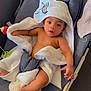 Isïah participe au concours pour gagner de l'argent avec cette photo : baby, towel, hooded_towel, infant, baby_seat, gray_fabric, bare_chest, curious_expression, indoor, furniture, couch, blanket, child, skin, foot, hand, relaxing, comfort, portrait, baby_boy