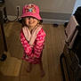 child, girl, smile, pink, robe, hat, barbie, princesses, barefoot, wooden_floor, kitchen, appliance, towel, happy, clothing, indoor, person, floor, cute, portrait