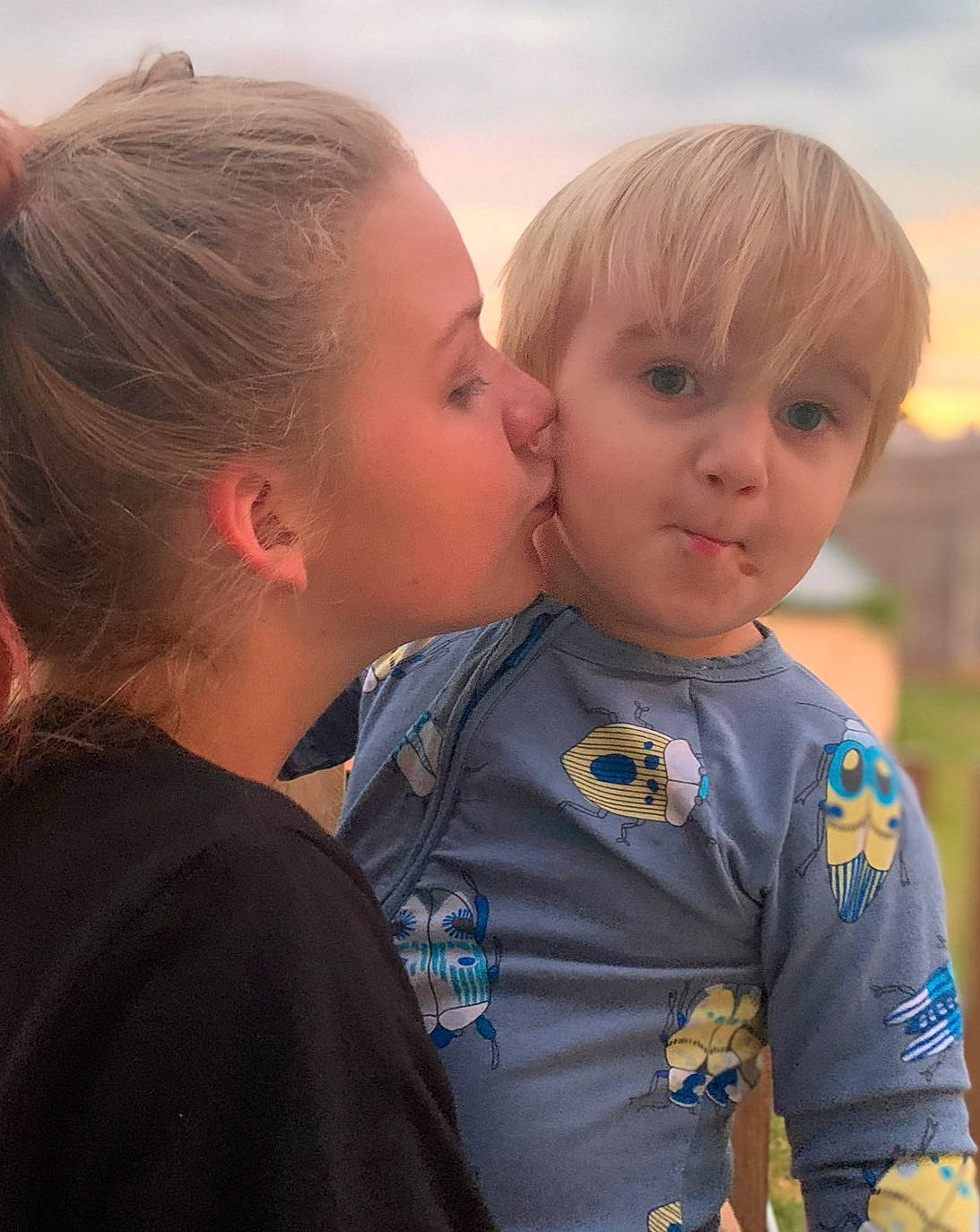 Jerry is registered to the contest to win money with this photo: baby_toddler_clothing, blond, cheek, child, ear, eyelash, forehead, hairstyle, interaction, iris, kiss, lip, love, mammal, neck, organ, people, person, sharing, skin