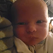 Dexter is registered to the contest to win money with this photo: baby, blanket, child, closeup, comfort, cozy, cushion, expression, face, head, indoors, infant, newborn, person, portrait, resting, skin, sleepy, soft_lighting, young