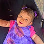 apparel, baby, baby_girl, casual, cheerful, child, childhood, cute, face, hair_accessory, happy, infant, person, pink_shirt, portrait, purple_bow, purple_dress, sitting, smiling, young