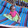 accessories, child, clothing, crib, face, female, footwear, furniture, girl, glasses, hammock, head, infantbed, person, photography, portrait, shoe, sitting, summer, sunglasses