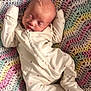 newborn, baby, sleeping, onesie, heart_pattern, crocheted_blanket, colorful, infant, peaceful, cozy, soft, cute, child, portrait, indoors, resting, young, toddler, sleep, fabric