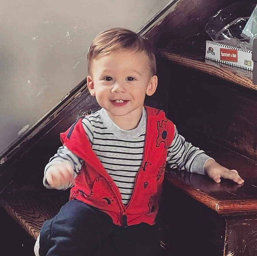 Dennis is registered to the contest to win money with this photo: baby, baby_toddler_clothing, child, cloud, cool, couch, electronic_device, eye, flash_photography, fun, happy, joy, organ, person, sky, sleeve, smile, standing, t_shirt, toddler