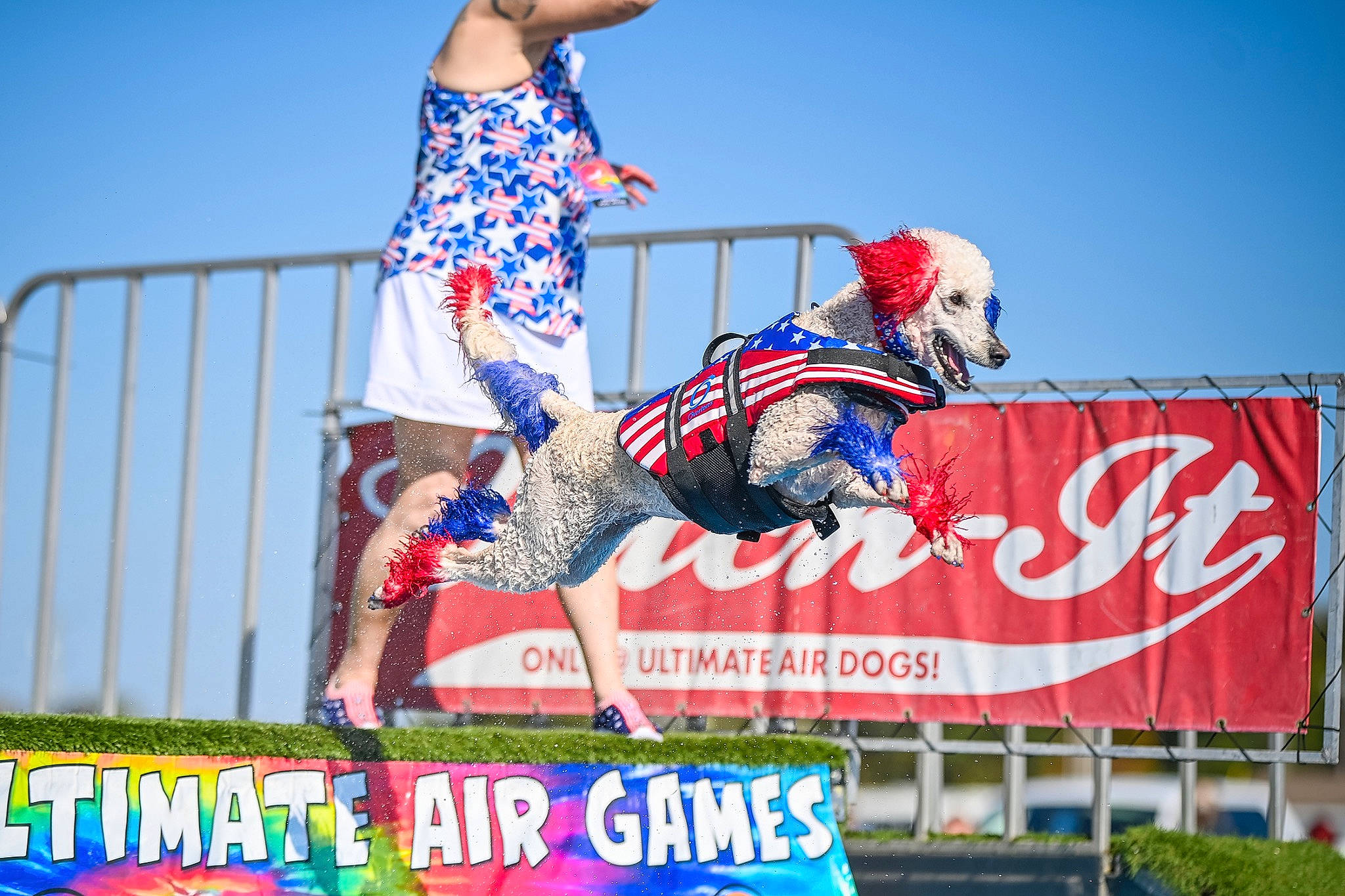 Poppy is registered to the contest to win money with this photo: advertising, championship, competition, competition_event, event, extreme_sport, fun, grass, helmet, leisure, logo, player, public_event, racing, recreation, sky, sports, sports_equipment, sports_uniform, tournament