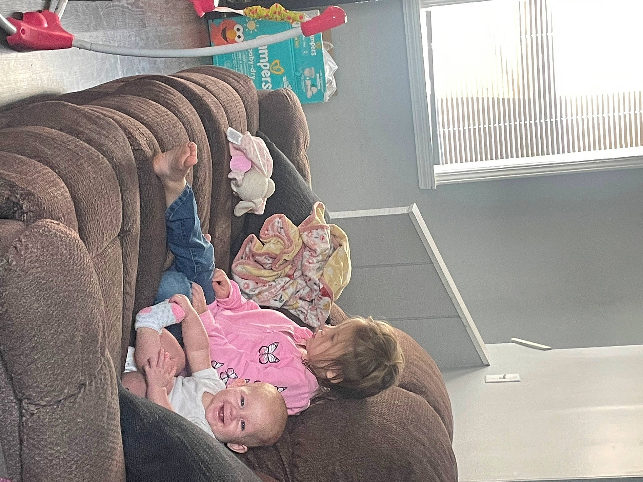 Harper is registered to the contest to win money with this photo: baby, baby_products, baby_toddler_clothing, child, comfort, couch, flooring, joy, nap, person, room, sitting, toddler, travel