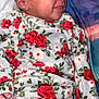 baby, bed, blanket, child, clothing, cozy, cute, face, floral, hand, happy, infant, onesie, peaceful, portrait, resting, sleeping, smiling, soft, young