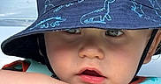 Karter joined the competition — help win amazing prizes! baby, blue_hat, bucket_hat, child, childhood, close_up, curious_expression, cute, dinosaur_pattern, eyes, face, hat, life_vest, mouth_open, outdoor, person, portrait, skin, summer, toddler