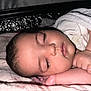 Inaya Rekad a rejoint le concours — aidez-le/la à gagner de superbes lots ! baby, sleeping, face, infant, blanket, arm, hand, soft, closeup, peaceful, skin, eyelashes, rest, comfort, indoors, portrait, child, newborn, cute, quiet