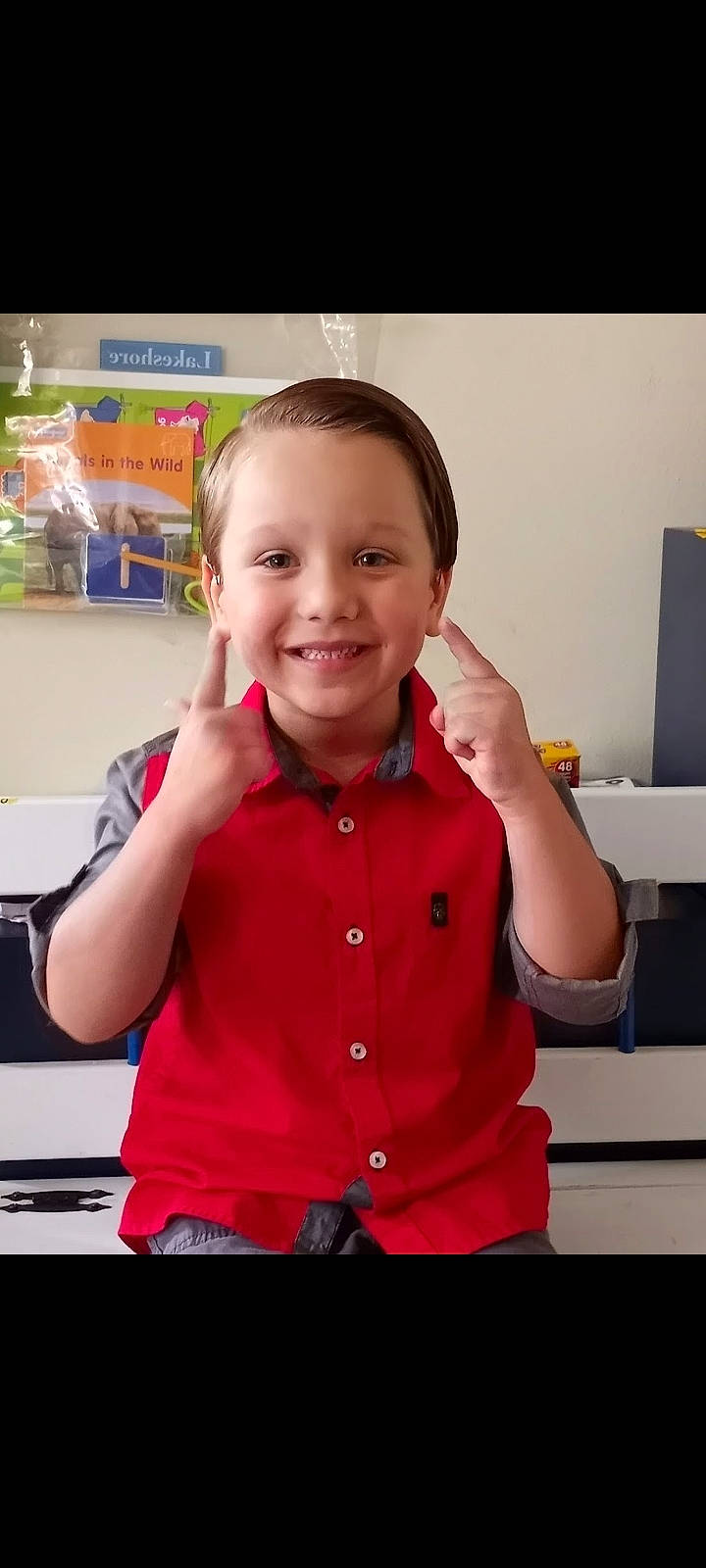 Kayden is registered to the contest to win money with this photo: baby, baby_toddler_clothing, cheek, child, finger, fun, gesture, happy, joy, magenta, pattern, person, play, room, shoulder, sitting, skin, sleeve, smile, t_shirt