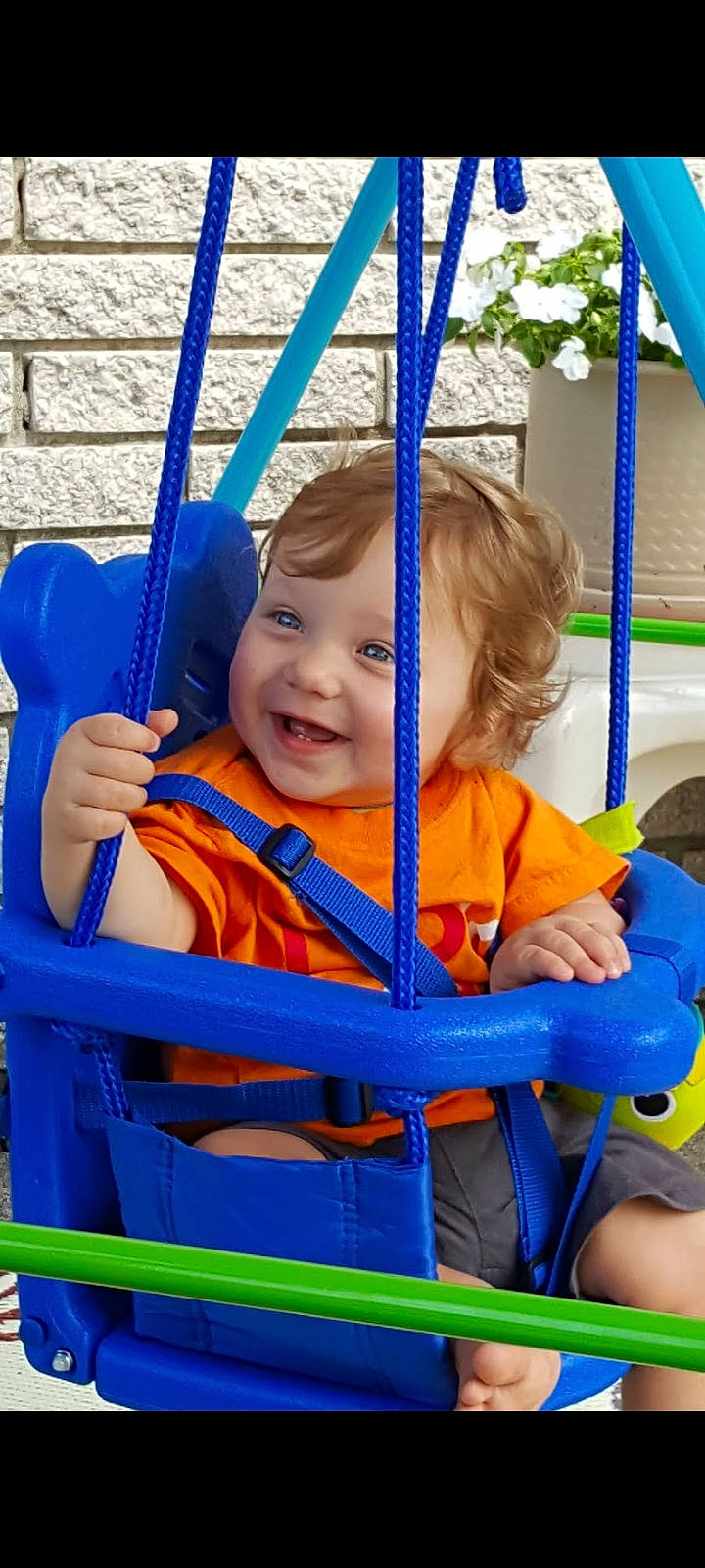 Kayden joined the competition — help win amazing prizes! baby_toddler_clothing, blue, child, city, electric_blue, facial_expression, fun, grass, happy, human_settlement, joy, leisure, outdoor_play_equipment, person, public_space, recreation, skin, smile, swing, tire
