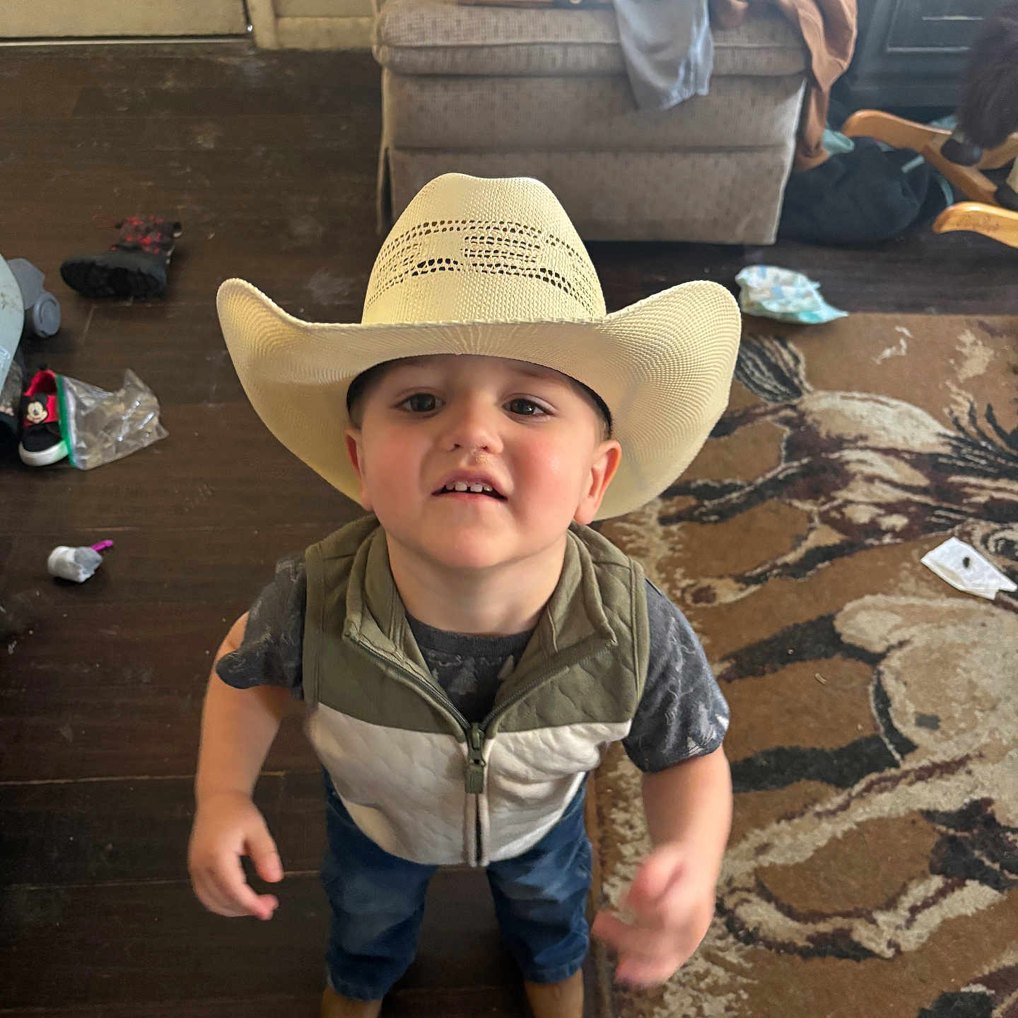 Jaxson is registered to the contest to win money with this photo: accessories, bag, boy, child, clothing, couch, cowboyhat, face, footwear, furniture, handbag, hat, head, jeans, male, pants, person, photography, shoe, sunhat