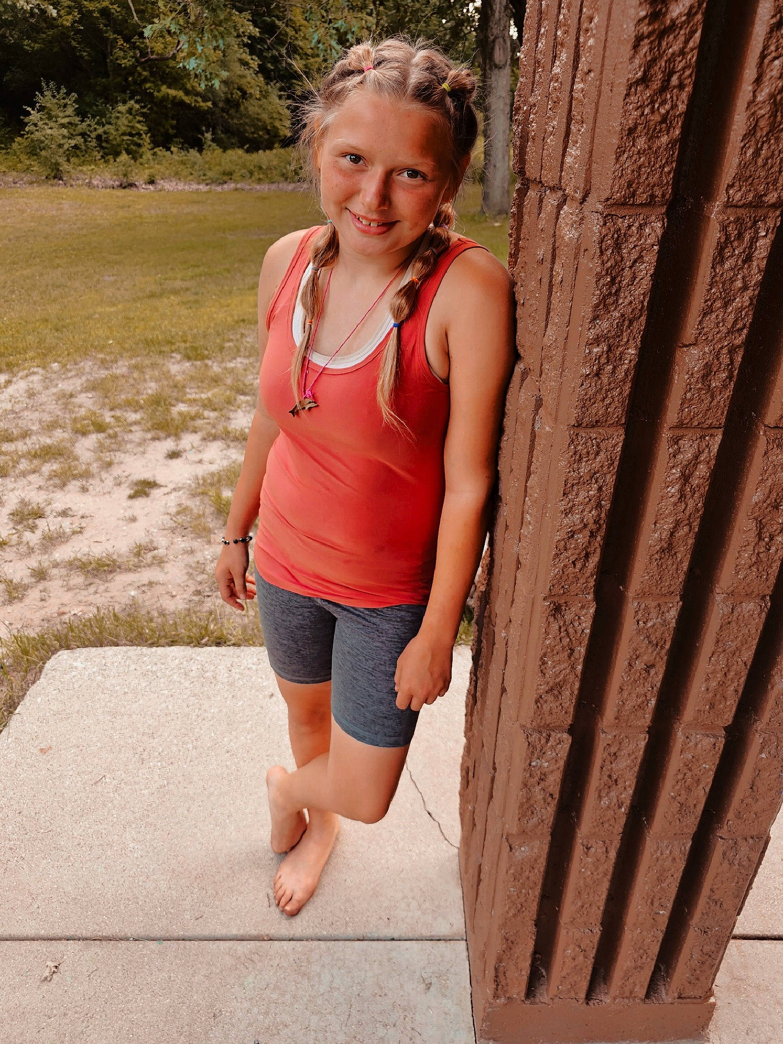 Jazmyn is registered to the contest to win money with this photo: abdomen, chest, clothing, electric_blue, eyewear, happy, human_leg, joy, leisure, neck, people_in_nature, person, recreation, shoulder, sleeve, smile, sportswear, t_shirt, thigh, tree