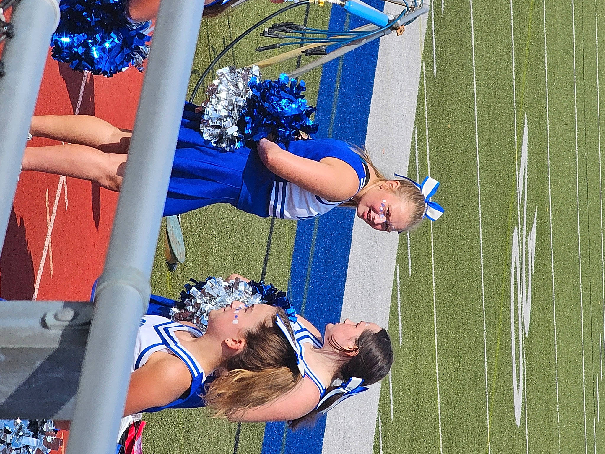 Jazmyn is registered to the contest to win money with this photo: blue, cheerleading, cheerleading_uniform, competition, competition_event, electric_blue, event, fun, grass, hat, human_leg, joy, leisure, performing_arts, person, player, public_event, recreation, smile, sports