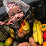 Jahdrian is registered to the contest to win money with this photo: baby, chef_hat, cooking_pot, fruit, vegetables, banana, orange, sweet_potato, avocado, pineapple, red_bell_pepper, yellow_bell_pepper, kitchen, reflection, cute, child, portrait, food, playful, gourmet