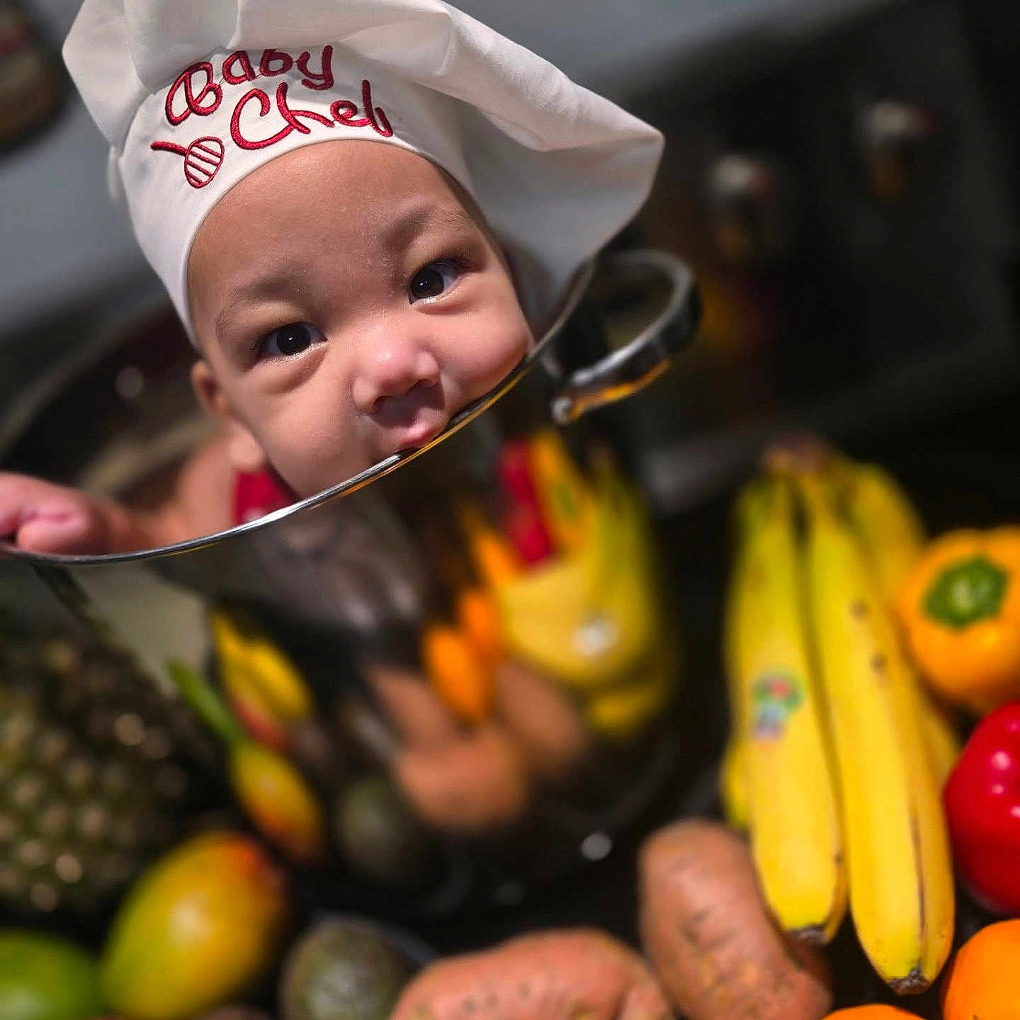 Jahdrian is registered to the contest to win money with this photo: avocado, baby, banana, chef_hat, child, cooking_pot, cute, food, fruit, gourmet, kitchen, orange, pineapple, playful, portrait, red_bell_pepper, reflection, sweet_potato, vegetables, yellow_bell_pepper