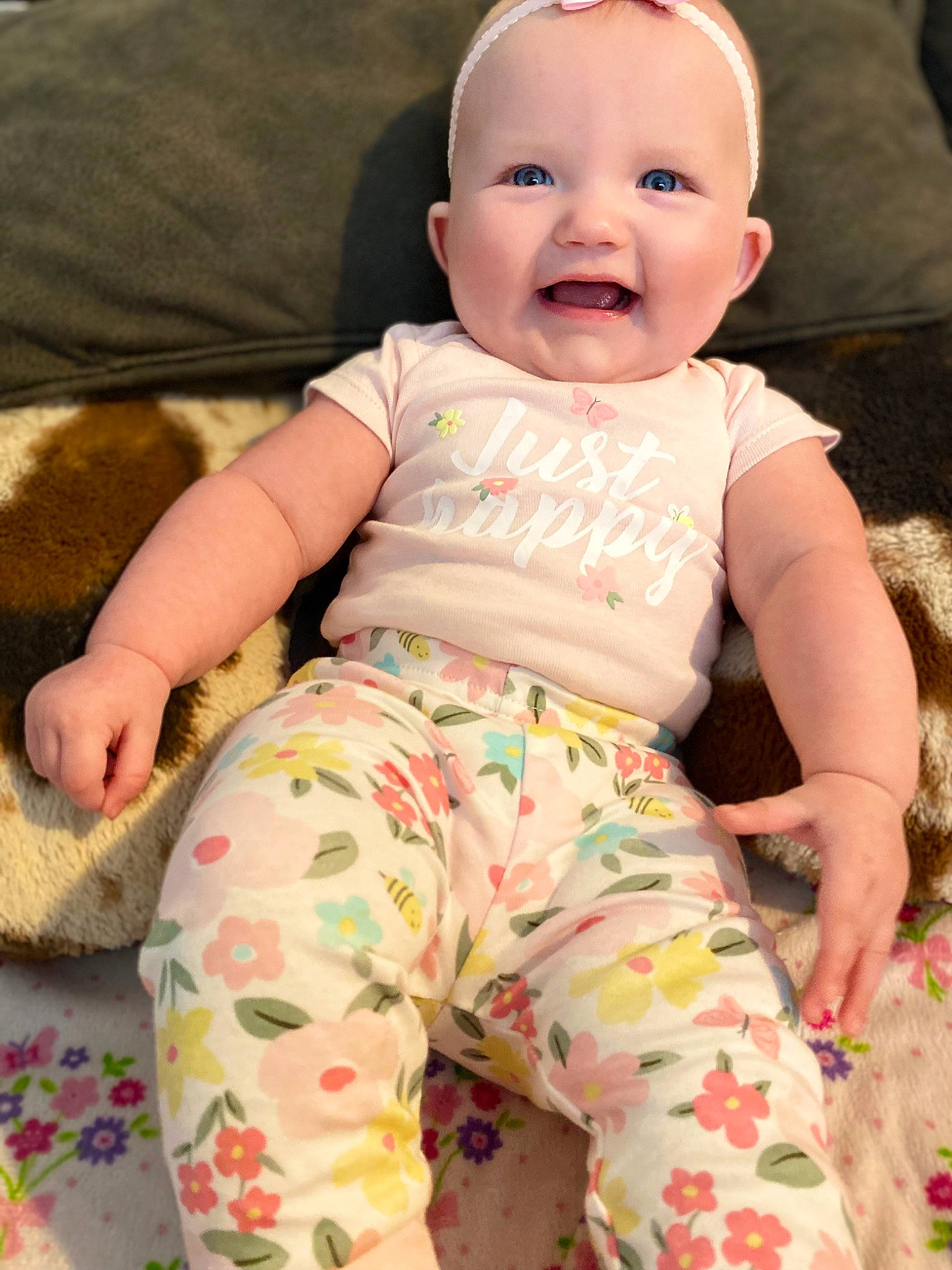 Ashleigh is registered to the contest to win money with this photo: baby, baby_toddler_clothing, cheek, child, comfort, eye, face, fun, happy, linens, pattern, person, pink, product, sitting, skin, sleeve, smile, t_shirt, thigh