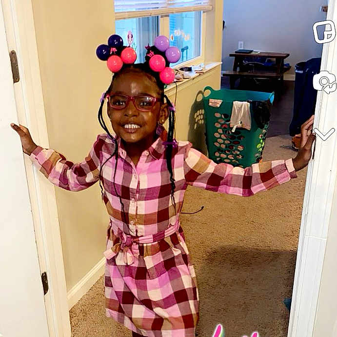 Abraya is registered to the contest to win money with this photo: accessories, blouse, child, clothing, door, face, female, girl, glasses, hair, happy, head, indoors, person, photobombing, photography, portrait, purple, sleeve, smile