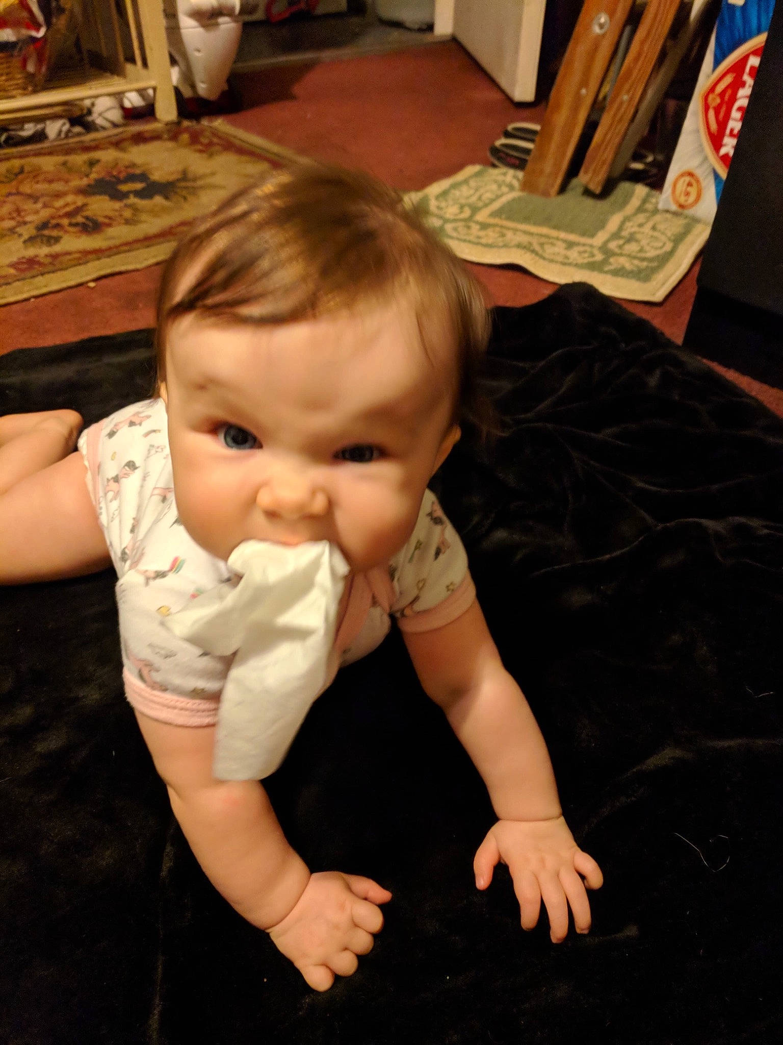 Sienna is registered to the contest to win money with this photo: arm, baby, cheek, child, finger, flooring, hand, head, joy, mouth, person, sitting, skin, toddler