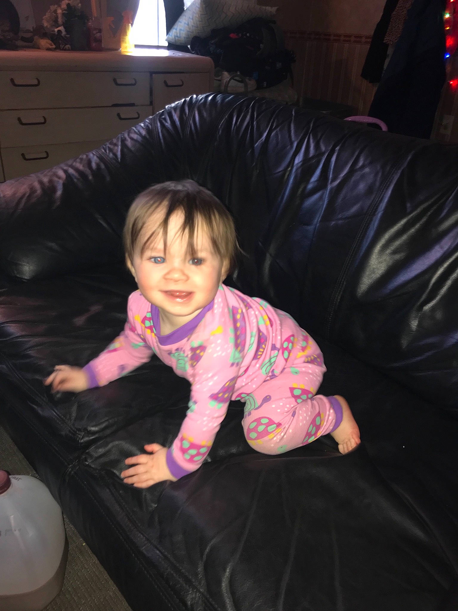 Sienna is registered to the contest to win money with this photo: baby, black_hair, cheek, child, electronic_device, fun, person, pink, play, sitting, skin, technology, toddler