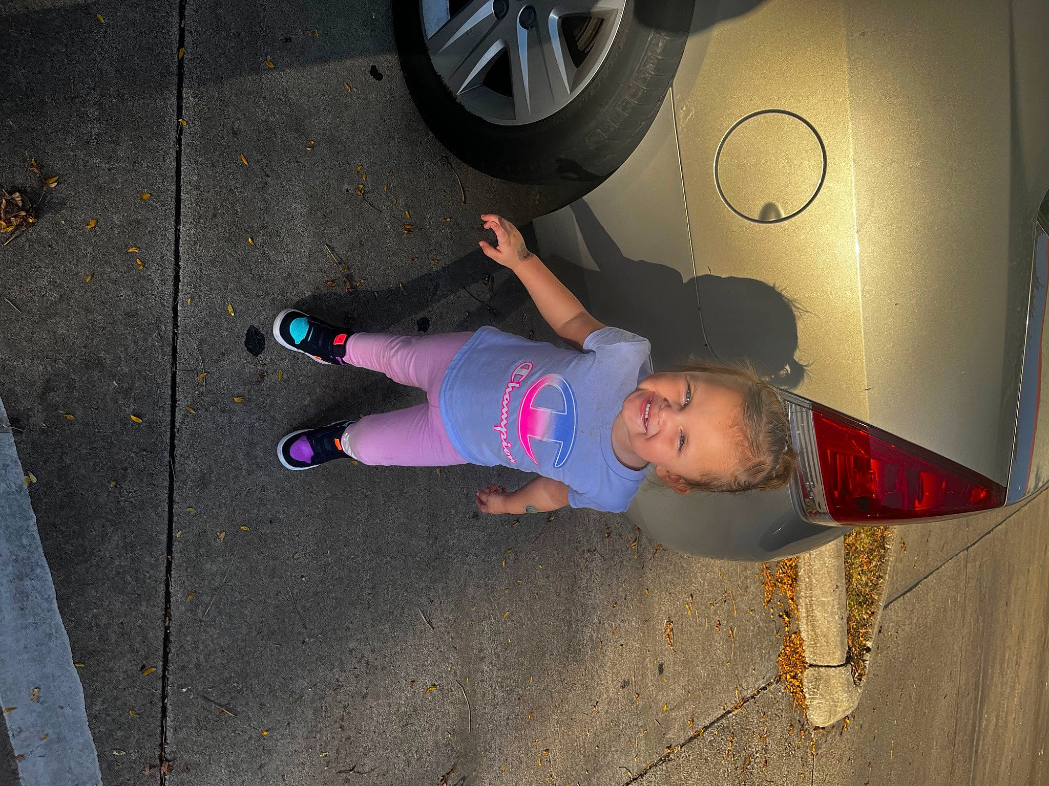 Lilyana is registered to the contest to win money with this photo: asphalt, automotive_tire, electric_blue, fender, fun, hat, hubcap, human_leg, joy, knee, leg, motor_vehicle, person, rim, shoe, sneakers, thigh, tire, tire_care, tread