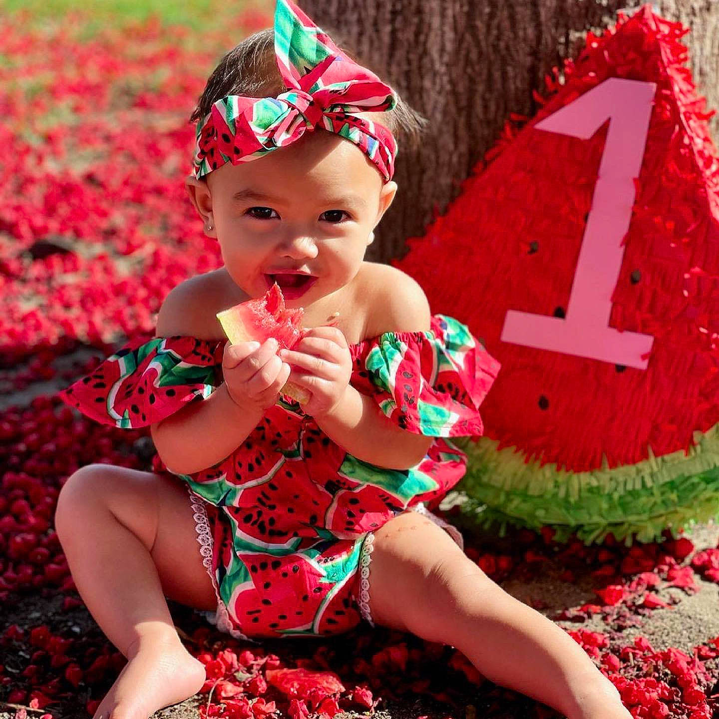 Avanleigh is registered to the contest to win money with this photo: baby_toddler_clothing, cap, costume_hat, dress, face, grass, green, happy, hat, head, headwear, human_body, leaf, lip, magenta, person, pink, red, skin, smile