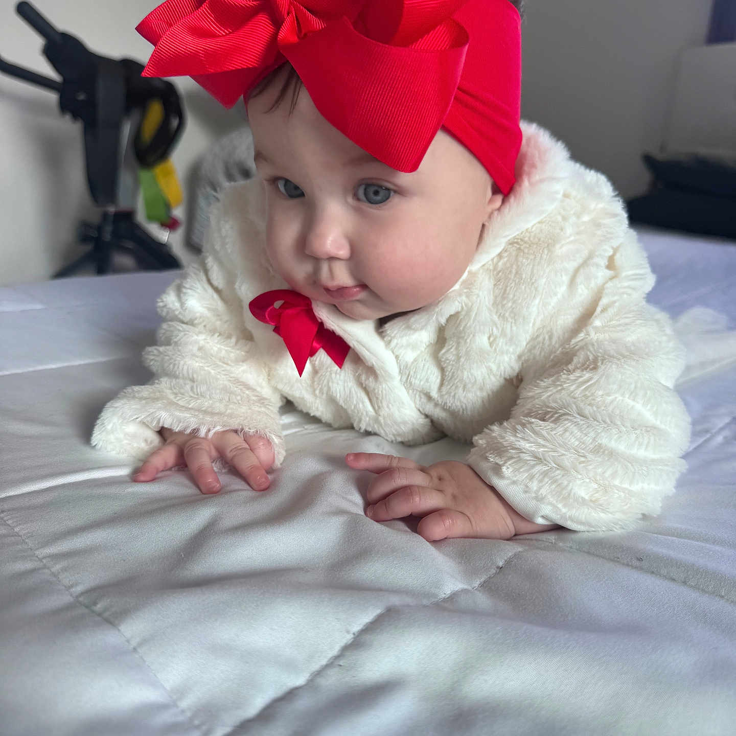 Ivanna joined the competition — help win amazing prizes! baby, bed, blue_eyes, child, closeup, cozy, crawling, curious, cute, face, fluffy_clothing, hands, headband, indoor, infant, portrait, quilt, red_bow, soft_lighting, white_outfit