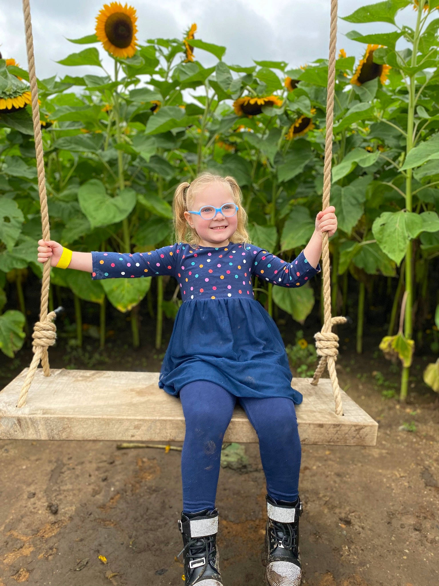 Aubree is registered to the contest to win money with this photo: annual_plant, botany, field, flower, flowering_plant, fun, garden, gesture, grass, green, happy, head, joy, leaf, people_in_nature, person, plant, sky, smile, terrestrial_plant