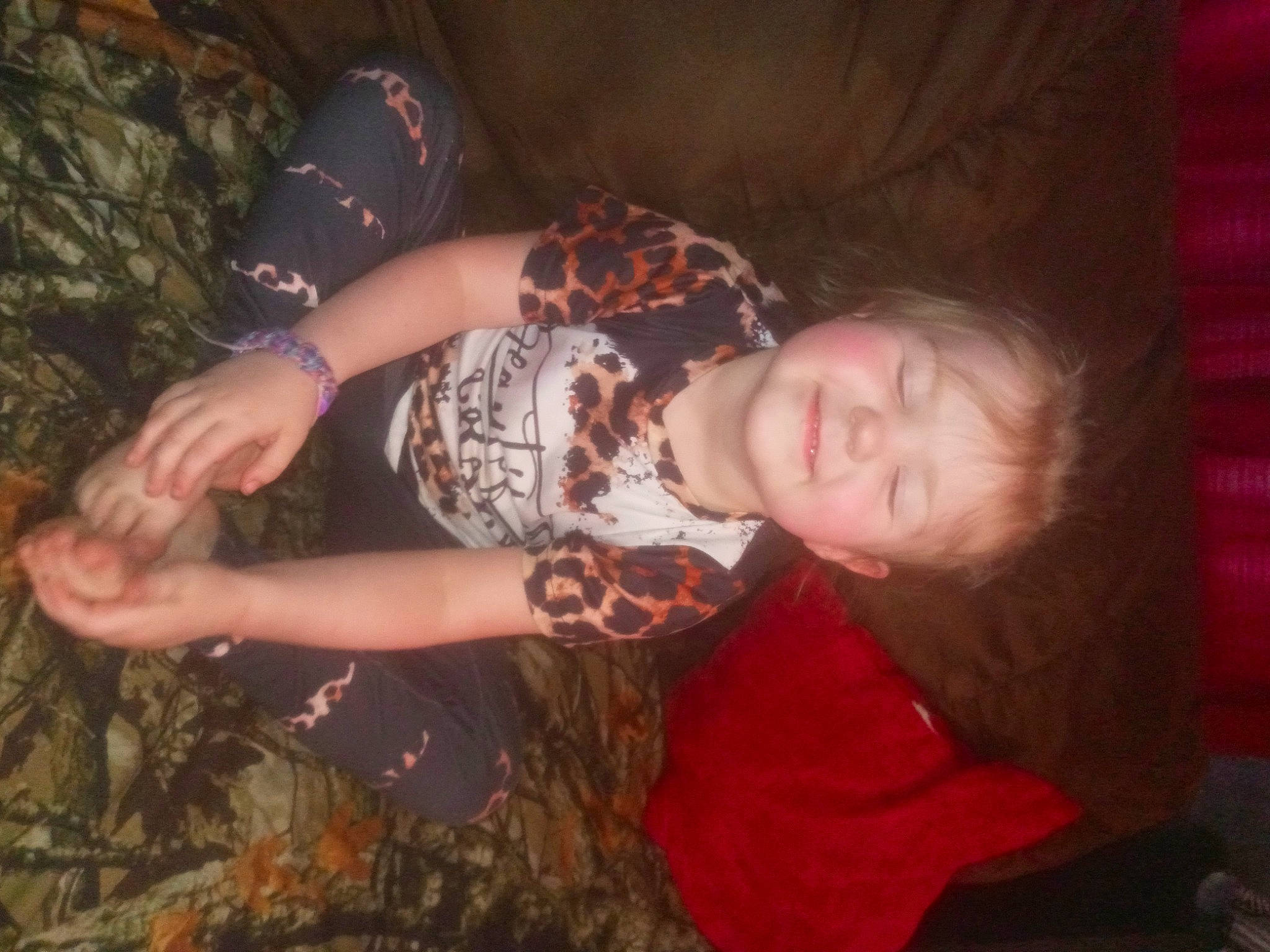 Brooklynn is registered to the contest to win money with this photo: flesh, fun, grass, happy, human_leg, joy, pattern, people_in_nature, person, plant, room, sitting, sleeve, soil, thigh, thumb, tree, wood, wrist