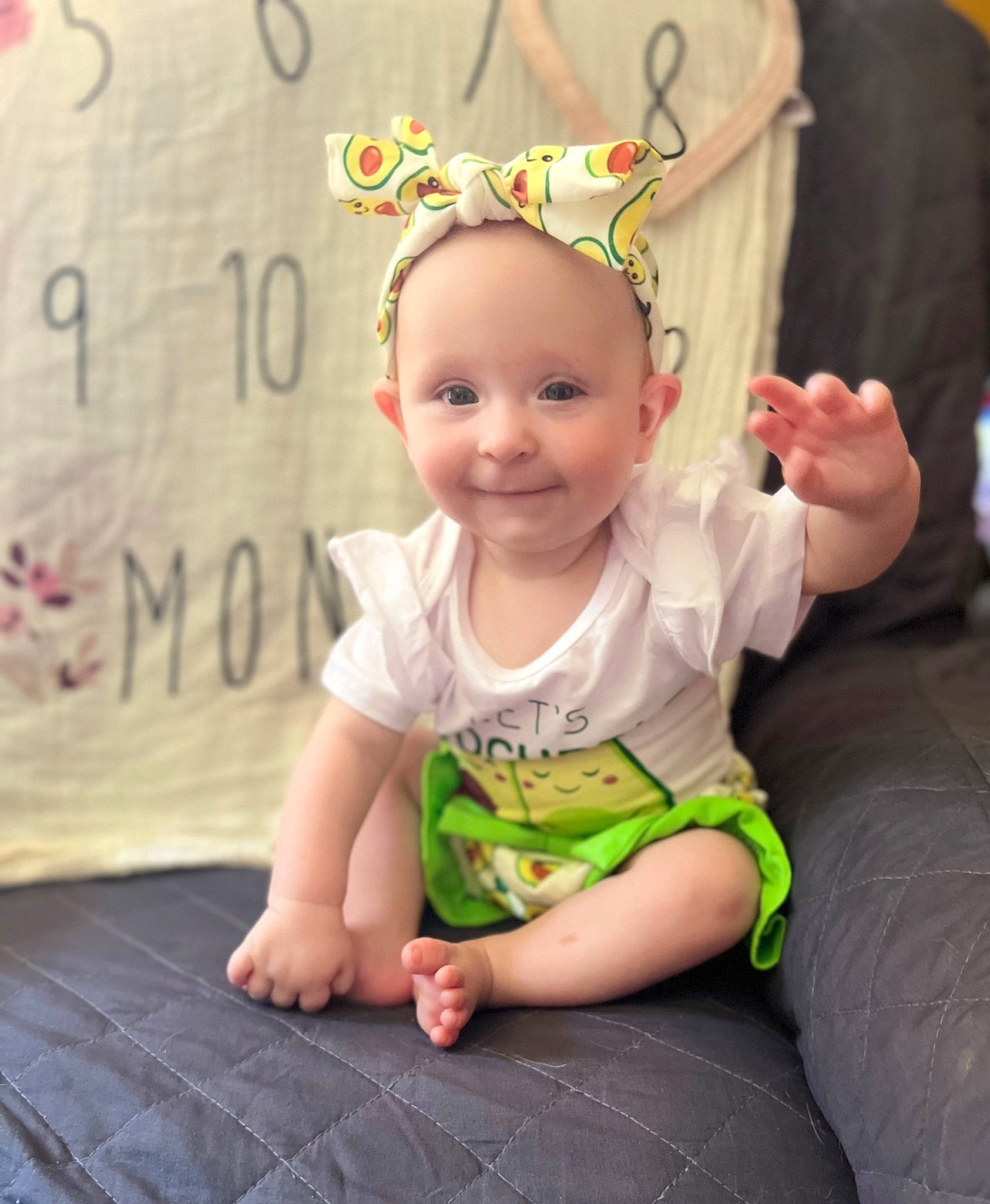 Mollie is registered to the contest to win money with this photo: baby, baby_toddler_clothing, cheek, child, eye, face, finger, fun, grass, happy, headband, headpiece, iris, joy, magenta, person, pink, skin, sleeve, smile