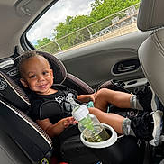 Christian joined the competition — help win amazing prizes! accessories, boy, car, car_interior, carseat, chair, child, clothing, cushion, footwear, furniture, glove, homedecor, jewelry, male, necklace, person, shoe, transportation, vehicle