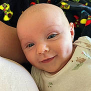 Heidi is registered to the contest to win money with this photo: baby, smile, face, dimples, onesie, infant, closeup, cute, child, skin, eyes, head, young, portrait, apparel, blanket, comfort, resting, happy, indoors