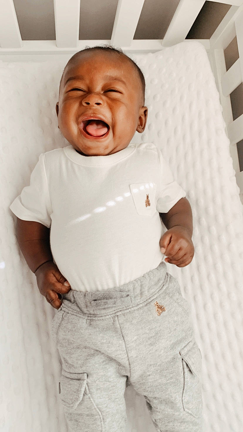 Jessie is registered to the contest to win money with this photo: baby, baby_toddler_clothing, child, collar, comfort, dress_shirt, elbow, gesture, happy, jaw, linens, pattern, person, portrait_photography, product, room, shout, sleeve, t_shirt, toddler