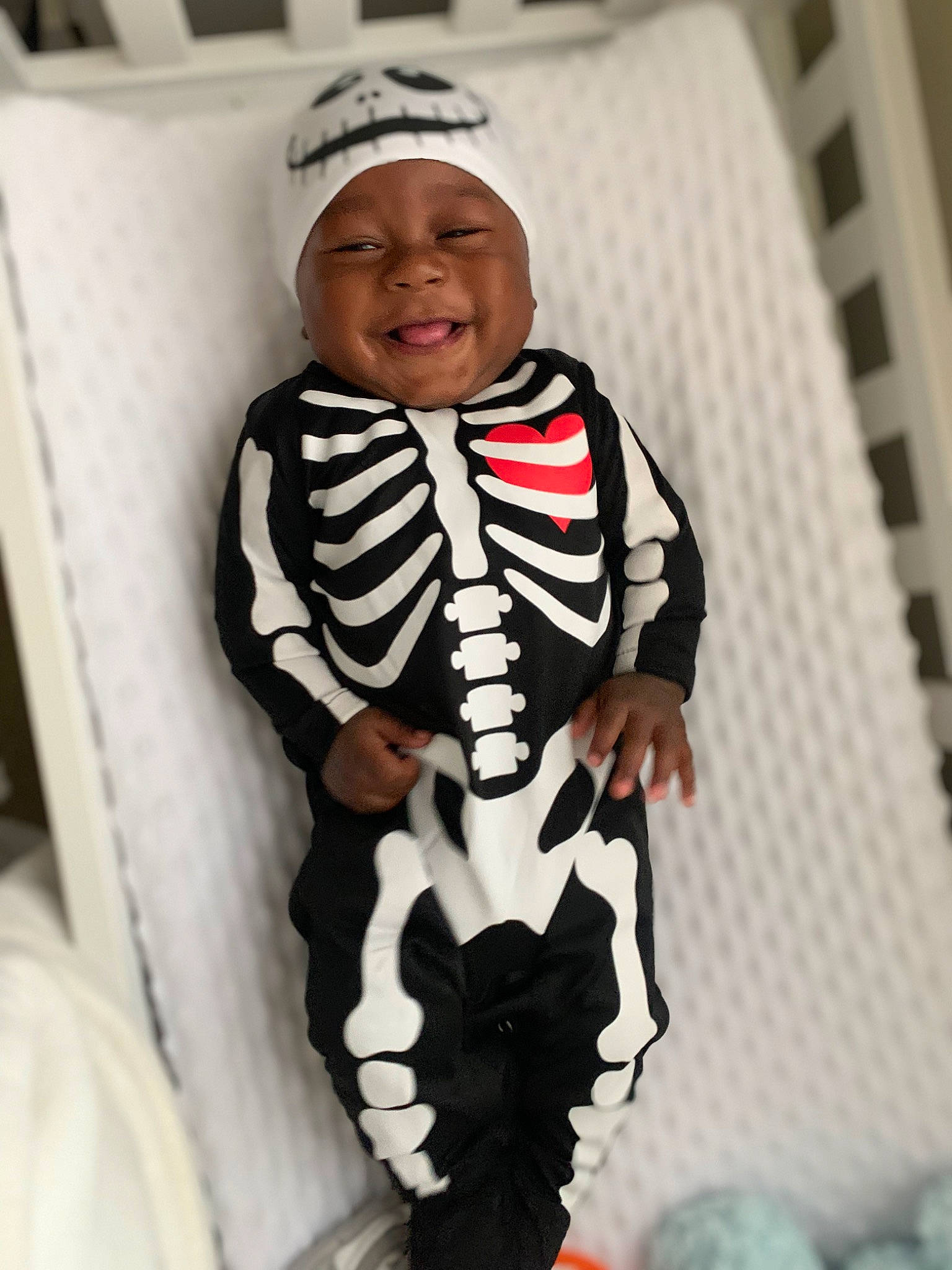 Jessie joined the competition — help win amazing prizes! arm, baby, baby_products, baby_toddler_clothing, beanie, black, cap, child, comfort, costume, fashion_design, happy, headwear, neck, pattern, person, sleeve, smile, t_shirt, thigh