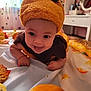 Filip a rejoint le concours — aidez-le/la à gagner de superbes lots ! baby, infant, pumpkin_hat, costume, tongue_out, cute, playful, autumn_leaves, bed, blanket, indoors, child, smiling, face, headwear, orange, yellow, brown, cozy, room