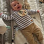 Elyo participe au concours pour gagner de l'argent avec cette photo : baby, infant, smiling, striped_shirt, khaki_pants, giraffe_toy, pacifier_clip, blanket, patterned_blanket, cute, milestone, 3_months, lying_down, happy, child, young_baby, indoors, soft_toys, person, playtime