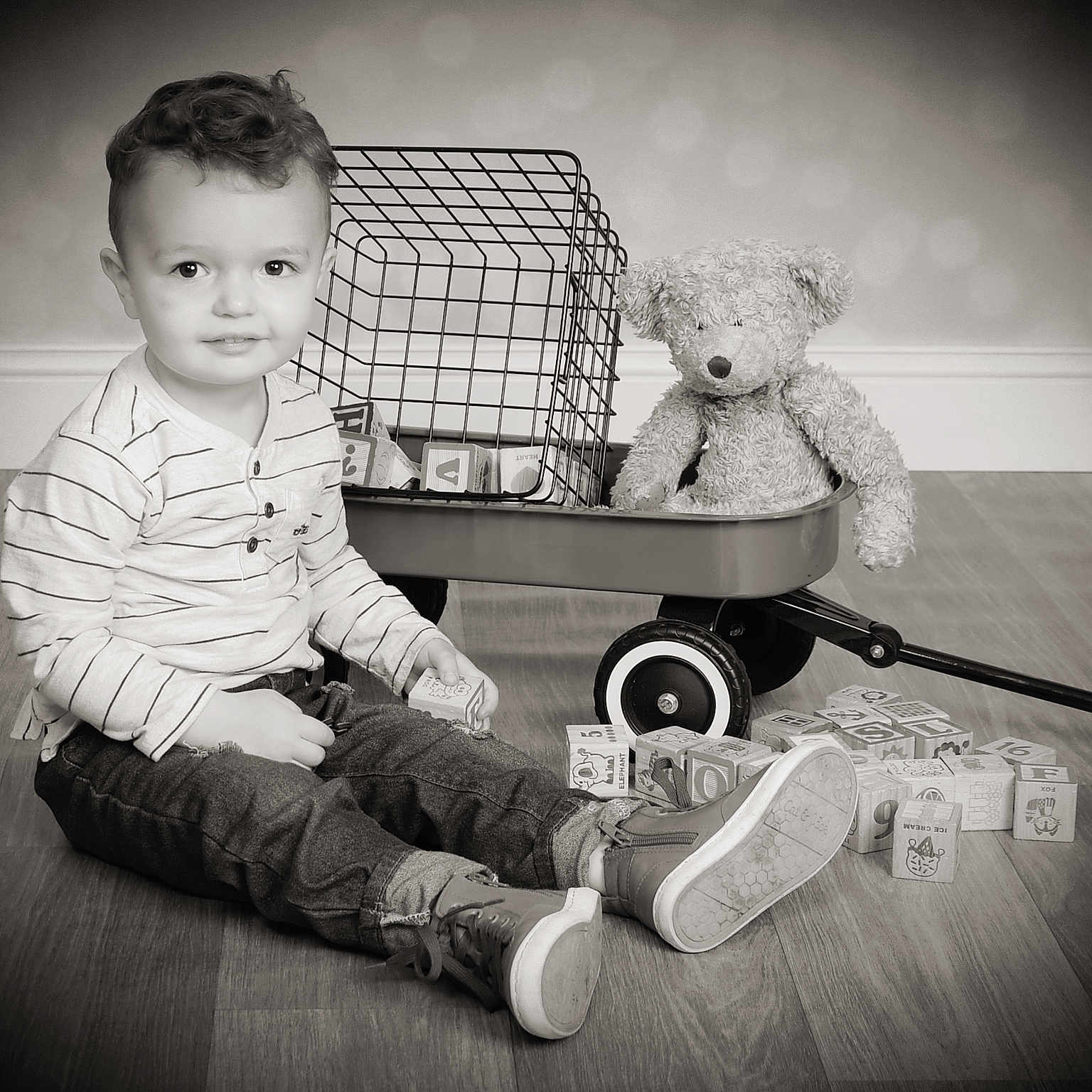 Hudson joined the competition — help win amazing prizes! bodypart, boy, child, clothing, couch, face, finger, footwear, furniture, hand, hardwood, head, machine, male, person, photography, portrait, shoe, wheel, wood