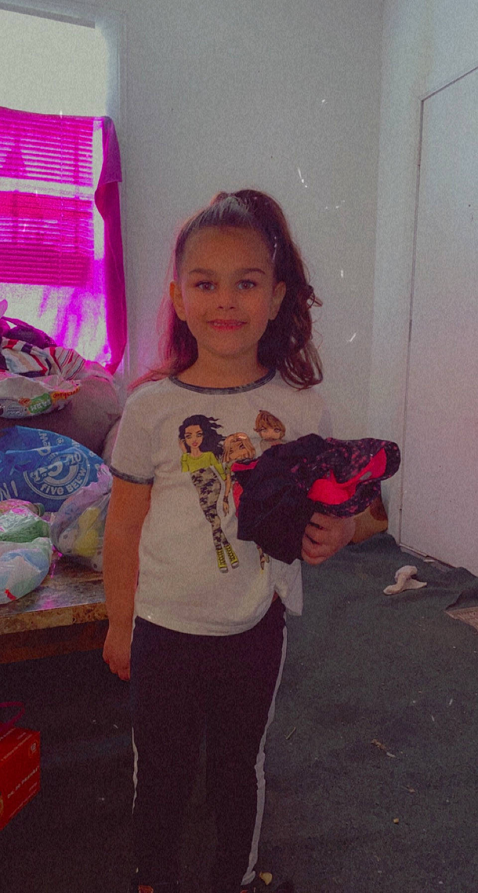 Riniyah is registered to the contest to win money with this photo: child, event, floor, flooring, fun, happy, joy, long_hair, magenta, pattern, person, pink, purple, room, shoulder, sleeve, smile, standing, t_shirt, textile