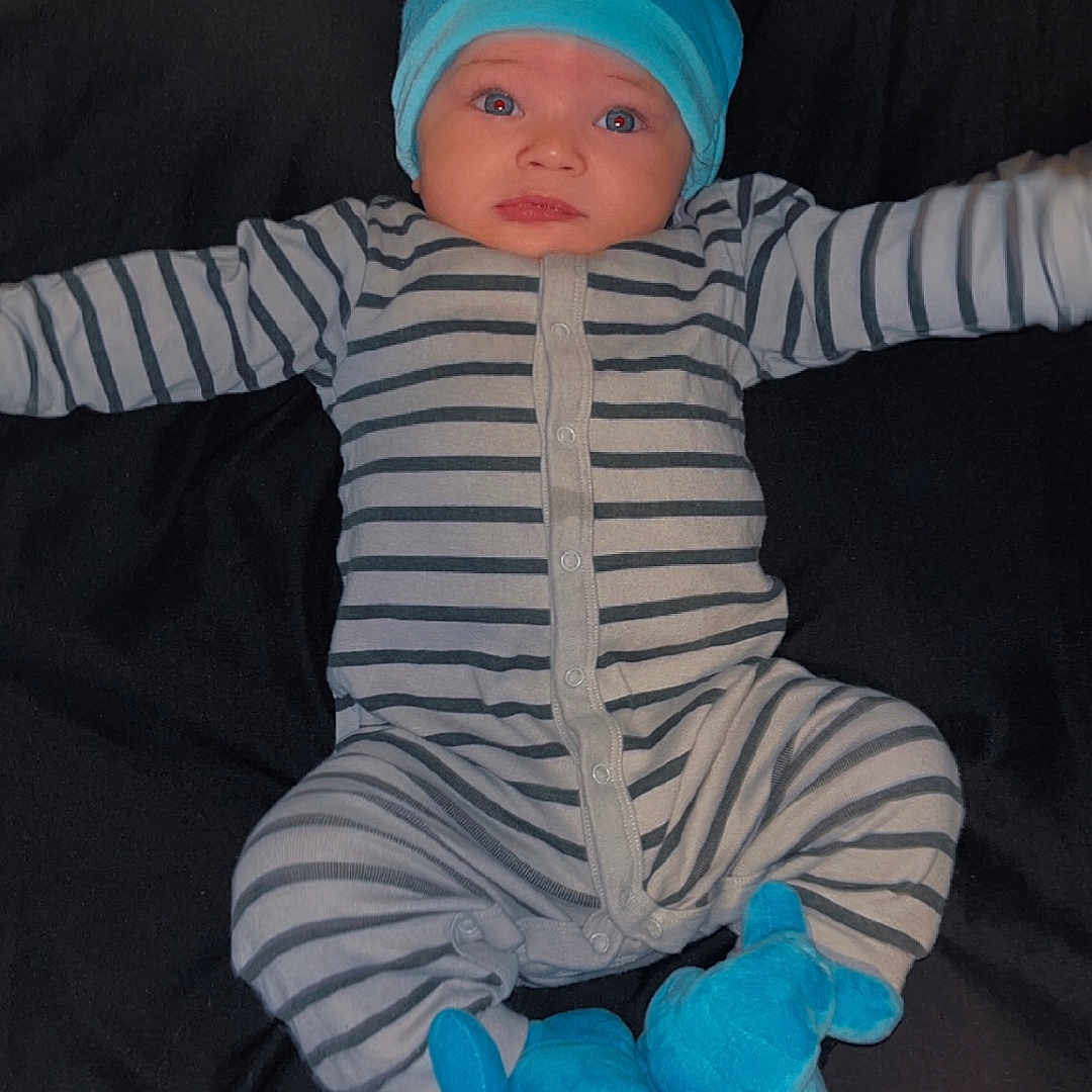 Mateo joined the competition — help win amazing prizes! baby, bonnet, cap, clothing, costume, couch, cushion, face, furniture, glove, hat, head, homedecor, newborn, pants, person, photography, portrait, sleeping, toy